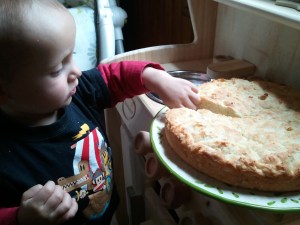 The finished cake I'm in my play kitchen with a real cake!