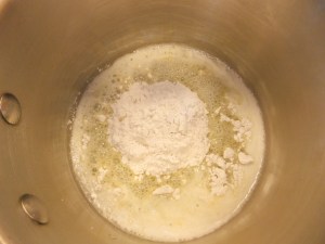 When butter's all foamy, add the flour all at once and start whisking.