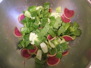 The cabbage and radish lie in their little blanket of salt.