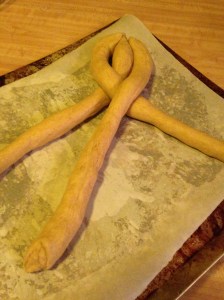 Now right goes over the center. Braid them loosely because they're going to need room to proof again.