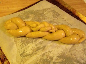 Egg wash the dough first, then adorn with any embellishments. Egg wash the add-ons, too.