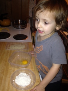 The flour helps the egg stick to the rice ball, and the egg helps the bread crumbs stay put.